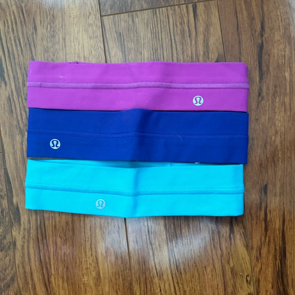 Lululemon headbands in pink, blue, and indigo